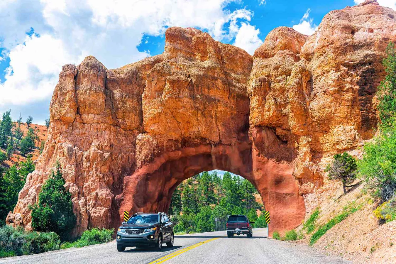 Road trip through a natural rock tunnel